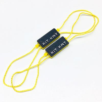 China Sustainable Custom Stamping Apparel Brand Logo Plastic Hang Tag String Seal For Garment for sale