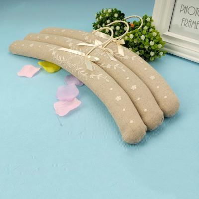 China Eco-friendly satin padded bridal wooden adult coat hanger/save space embroidery wedding hanger for women coat hanger for sale