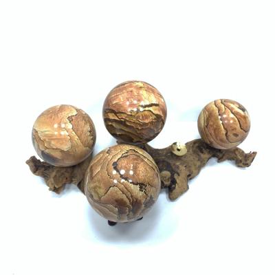 China Wholesale Healing Wooden Stone Crystal Ball Stone China Grain Decorative Crystal Crafts for sale