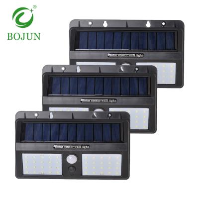 China Garage Garden Custom Smd PIR Sensor 8w Waterproof Private Patterned Solar Led Wall Light for sale