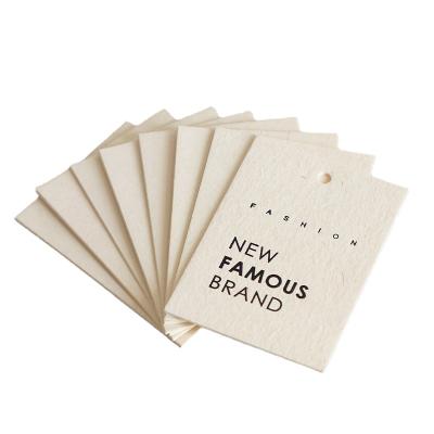 China Customized Eco-friendly Sustainable Jeans Hang Tags Garment Custom Printed Paper Tag Designs Card Clothing Tag for sale