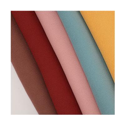 China Memory 100 polyester solid color como crepe foam crepe fabric with high elastic for sale