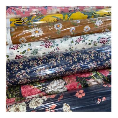 China 100% organic stock lot woven viscous rayon challis print shirts fabric for dress for sale