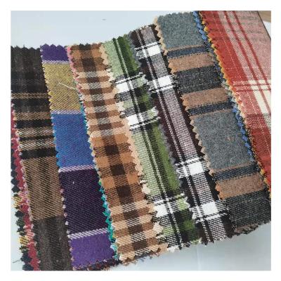 China Wholesale cheap woven fabric woven cotton CVC brown plaid flannel Shrink-resistant shirting stocklot poly brushed yarn dyed check fabric for sale