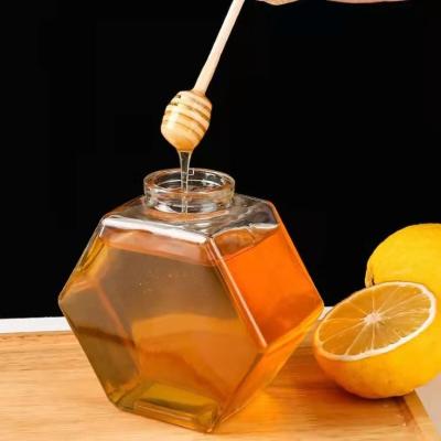 China New Design Hexagon Honey Jam Bottle Glass Jam Jar Food Storage Prismatic Honey Canned Stored Glass Jar for sale