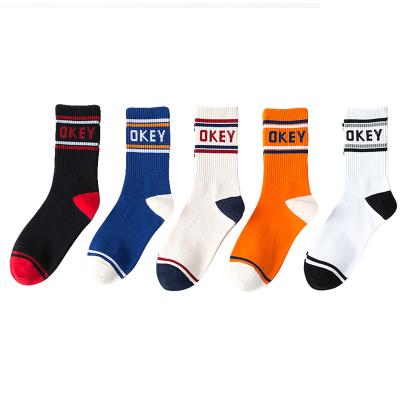 China Hot Sale QUICK DRY OKEY Letters Fashionable Basketball Sports Bangs Soft Cotton Vivid Color Funky Letters Striped Couples Socks for sale