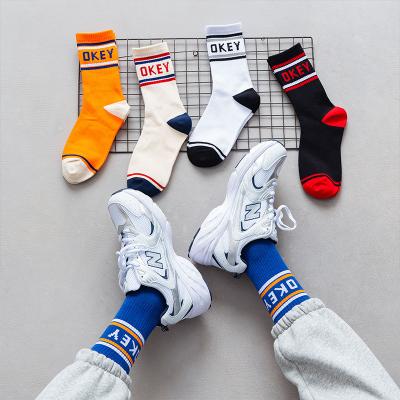 China Wholesale Hot Selling OKEY Letters Basketball Fashion Sports QUICK DRY Knocks Cotton Soft Vivid Color Letter Couples Funky Socks for sale