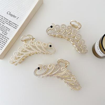 China Wholesale Girls Hair Decoration Hair Accessories 11.3cm Alloy Pearl Rhinestone Grip Clip Peacock Hair Claw Big For Women for sale