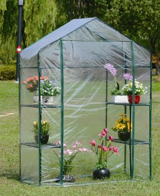 China Easily Assembled Walk In Greenhouse PVC Plastic Garden Grow Green House With 4 Shelves for sale