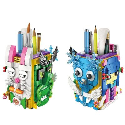 China Eco-Friendly Material WOMA TOYS Hottest Sale Children's Day Boy Cartoon Block Brick Pen Box Girl Pen Rack Pen Holders Little Small Building From Amazon for sale