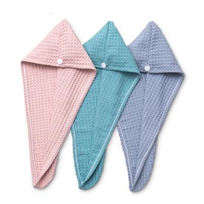 China Sustainable High Quality Super Soft Water Absorption Turban Towel Buttons Waffle Dry Hair Hat for sale