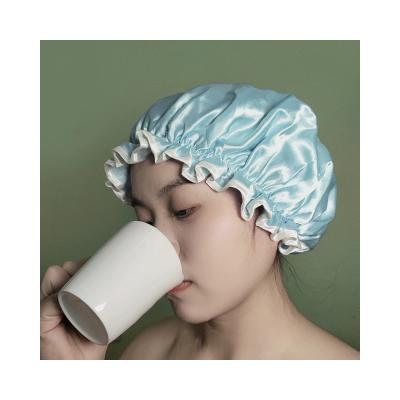 China Sustainable Custom Logo Women Spa Bath Accessories Double Layers Stain Waterproof EVA Shower Cap for sale