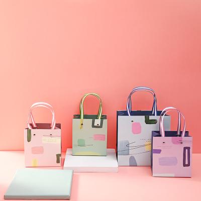 China Various Recycled Materials Creative Design Printing Recycling Colorful Paper Craft Shopping Bags Gift Bags for sale