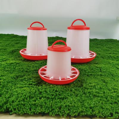 China Modern Red And White Cylinder Poultry Feeder 3.5L Capacity Waterproof And Easy To Clean for sale