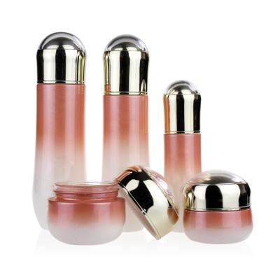 China Custom High Qiality 40ml/100ml Color Gradient Pink Lotion Glass Bottles Set Container Glass Jar Manufacturers Spray Pump Cosmetic Packaging for sale