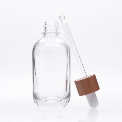 China Hot Selling Wholesale 55ml Serum Bottles 30ml Glass Bottle Fancy High Quality Clear Cosmetic Wooden Glass Bottle New Design for sale