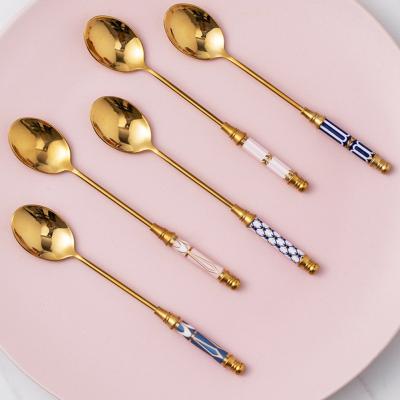 China Durable Stainless Steel Teaspoon Long Ceramic Handle Stirring Spoon Gold Plated Dessert Spoon for sale