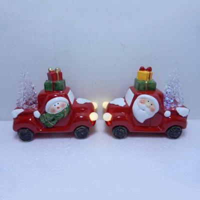 China Eco-friendly Ceramic Santa Claus And Snowman Driving Cars With LED Decoration For Christmas Holiday for sale