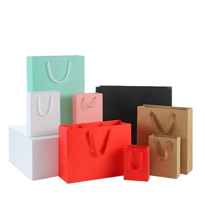 China Printed Your Own Logo Packaging White Brown Kraft Gift Craft Shopping Paper Bag With Ribbon Handles for sale