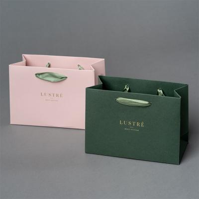 China Luxury Ribbon Handle Boutique Shopping Packaging Customized Printed Euro Tote Paper Gift Bags With Logo en venta