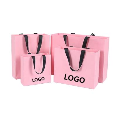 China Wholesale New Design Custom Logo Printing Shopping Brown Kraft Paper Bag With Handle à venda