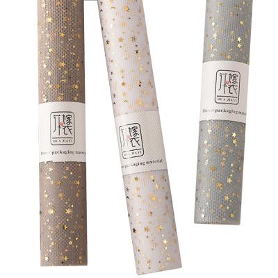 China Household DIY Bronzing Moon Gauze Holding Bouquet Lining Wrapping Mesh Flower Wrapping Paper Glitter Star Paper for sale