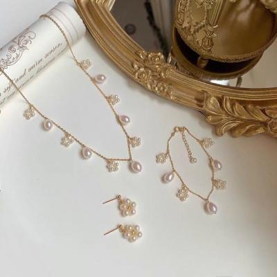 China Cute Korean Temperament Natural Freshwater Pearl Jewelry Set Necklace Bracelet 925 Silver Needle Earring Set Bride 14K Gold Plated for sale