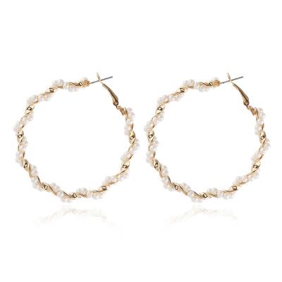 China 2021 fashion CLASSIC Korean style minimalistic spiral around big statement stud earrings drop pearl around gold earrings danglers women for sale