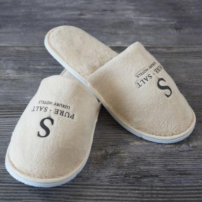 China Lightweight Wholesale Custom Hotel Disposable Slippers With Printed Logo for sale