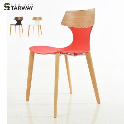 China Modern Wholesale Modern Wingback Plastic Chair Restaurant Dining Furniture Wood Leg Armless Din Nordic Chair for sale