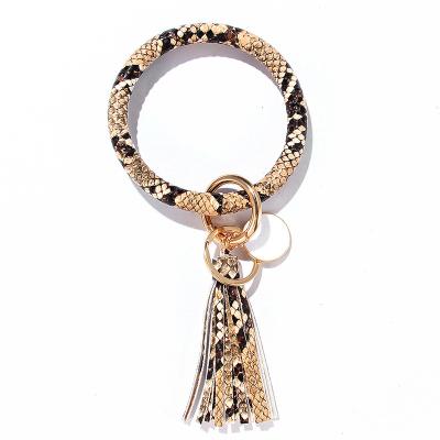 China Hot Selling Key Chain Bracelet PU Leather O Key Chain Bracelet Leather Personalized Bracelet Key Chain With Tassel for sale