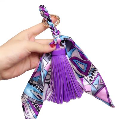 China PU Leather Scarf Bowknot Tassel Keychain 2021 Fashion Handmade Women Bag Ribbon Leather Tassel Key Chain for sale