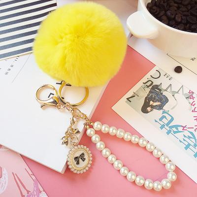 China Wholesale Fashion Plush Pom Pom Plush Key Chain Plush Ball Key Holder With Bead Chain for sale