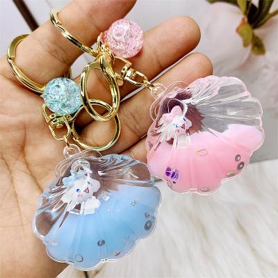 China Promotional Transparent Acrylic Oil Float Pendant Charm Doll Keychain Charm Doll Carton Liquid Milk Key Chain For Bag for sale