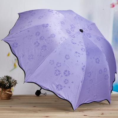 China Modern Magical Water Blossom Flower Color Changing 3 Times UV Manual Umbrella for sale