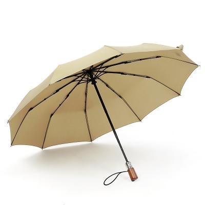 China Modern 10 Ribs Large Gift Business Automatic Black Coating Umbrella With Wooden Handle For Company Souvenirs for sale