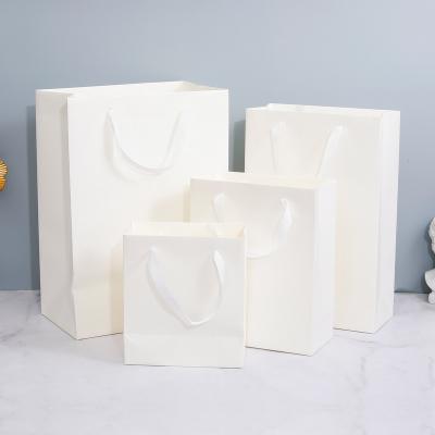 China Recycled Materials Wholesale Cheap Custom Luxury Paper Bag Fancy Wedding Favor Door Gift Paper Bag Logo Blue White Mini Small With Ribbon Handles for sale