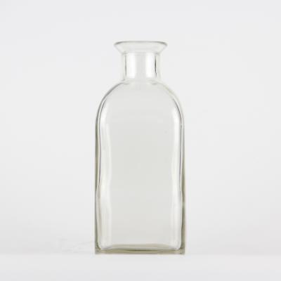 China High Quality Transparent Beverage 700ml Essential Oil Glass Bottle for sale