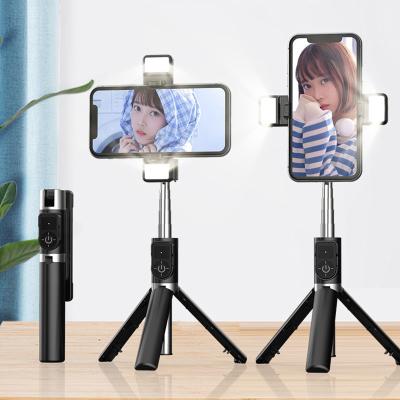 China 360 Degree Rotation Folding Light Radio Selfie Stick Tripod Mobile Phone Bracket Auto Timer Fill Light Remote Control for sale