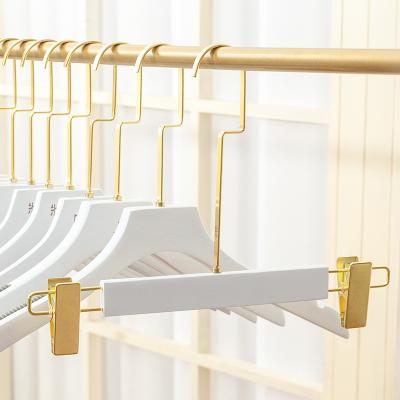 China Flat Shape Inspring Wooden Pants Hanger Wooden Pants Hanger With White Color And Gold Hook for sale