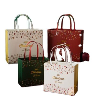 China Recyclable Design Christmas Red Christmas Dressing Paper Wholesale Art Party Gift Shopping Paper Bag With Bow. for sale