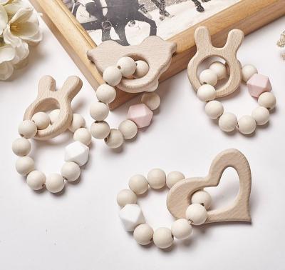 China Eco-Freindly Baby Care Bracelets Wooden Teether Silicone Beads Teething Wood Ratchets Wooden Teether Toys Beads Baby Toys Gifts for sale