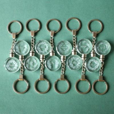 China Eco-friendly QIYUE LED Light Custom Laser Engraved Letter Crystal Glass Key Chain for sale