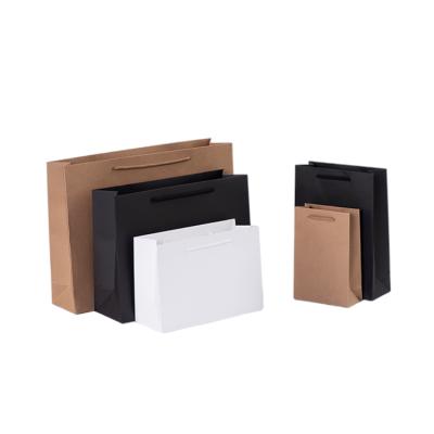 China Recyclable Biodegradable Fashion Shopping Food Kraft Black White Paper Bags With Handle for sale