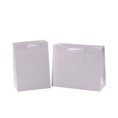 China Customized Recyclable Recycled Glitter Coated White Paper Gift Shopping Bags With Logo for sale