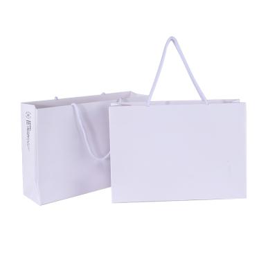 China Manufacturer White Blank Elegant Recyclable Christmas Drawstring Gift Bag With Handle for sale