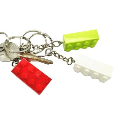 China New Style Key Chain 2021 Red Color Brick Silicone 2 Tiers Plastic Brick Key Chain With Metal Ring for sale