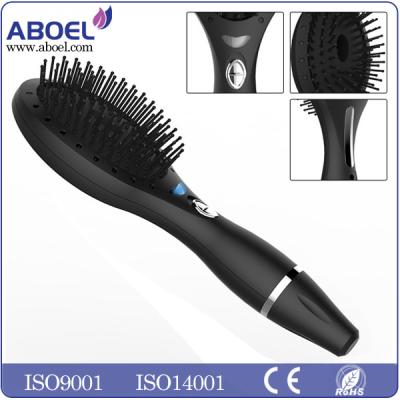 China Vibrating Led Light Ionic Hair Comb Portable Black Battery Operated for sale