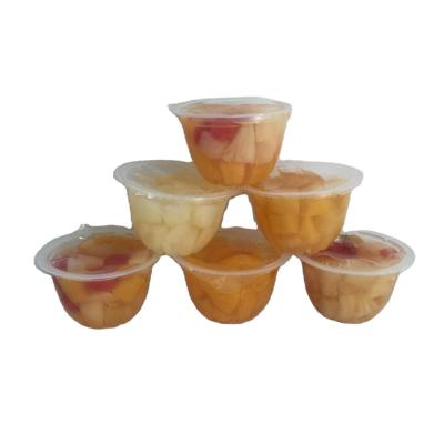 China Canned Fruits In Cup Syrup Peach Pear Tangerine Cocktail In 4oz Plastic Fuit Cup for sale