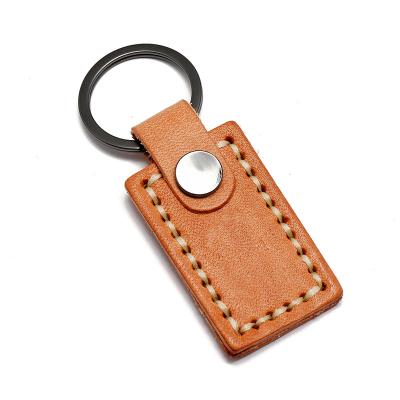 China Retro Simple Creative Personalized Metal Cowhide Key Chain Car Chain Pendant for sale